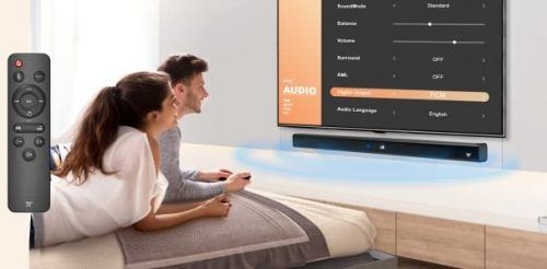 couple watching tv with a soundbar